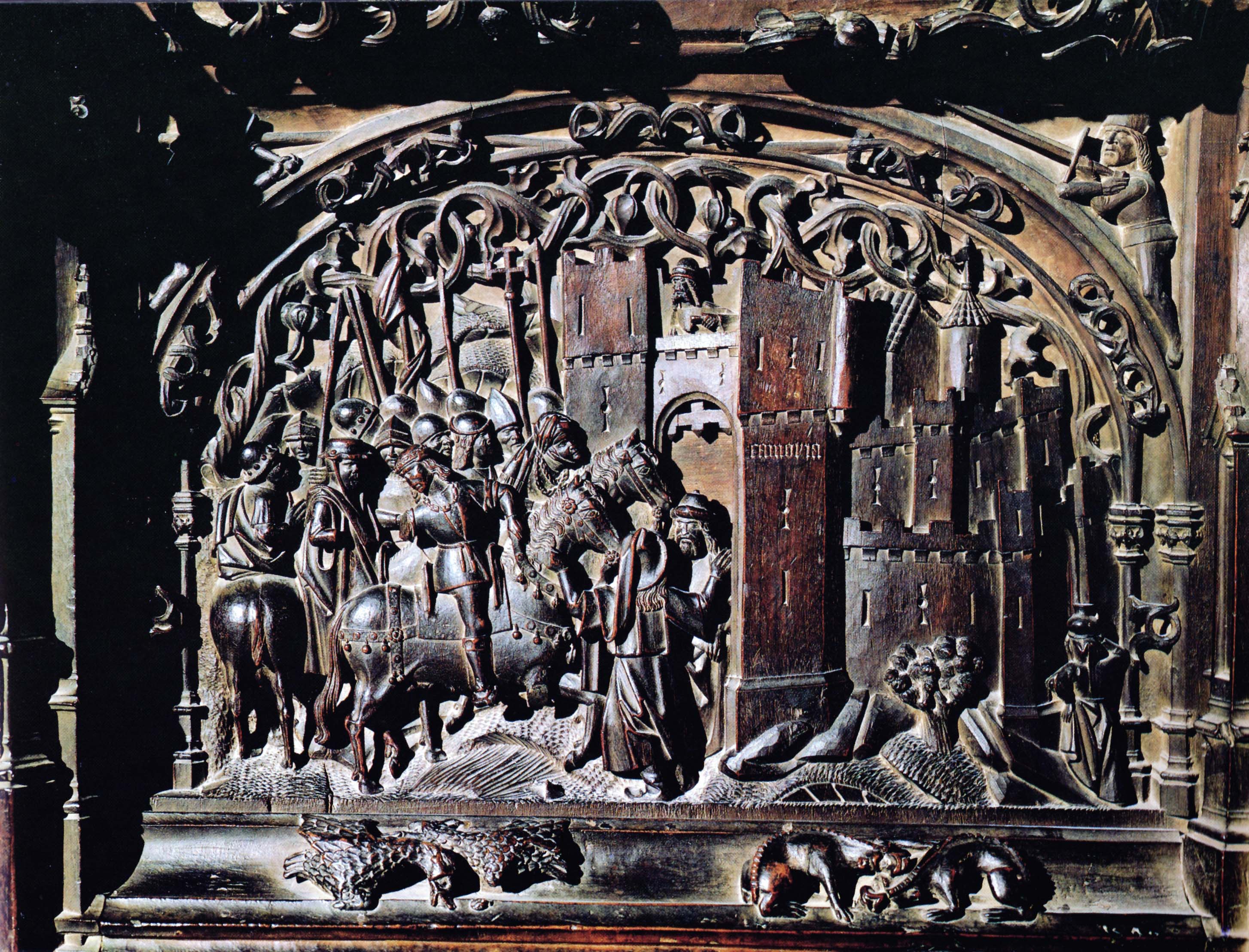Bajorrelieve con la rendición de Cantoria a los Reyes Católicos en la sillería del coro de la catedral de Toledo